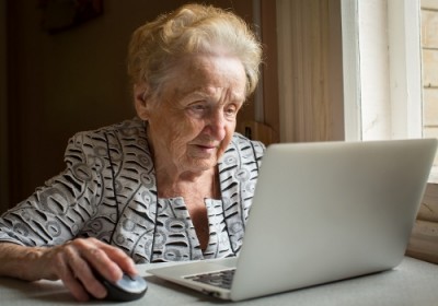 Woman in assisted living on her computer.